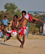 Raibenshe performers of Charkol-gram, Birbhum, putting on their best show for the Physical Cultures of Bengal team who stayed with them while working on a documentary.